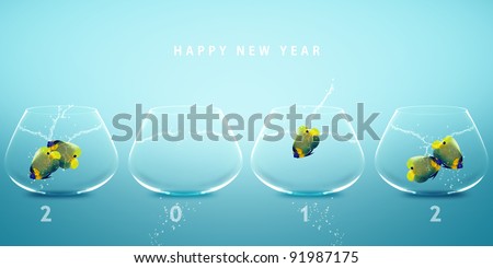 Happy new year 2012, conceptual image angelfish jumping to new fish bowl and creating 2012 year number.