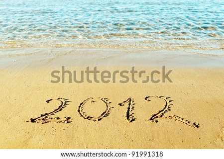 New Year is coming concept - the inscription "2012" on a beach sand