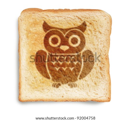 owl picture burnt mark on toast bread, isolated on white background