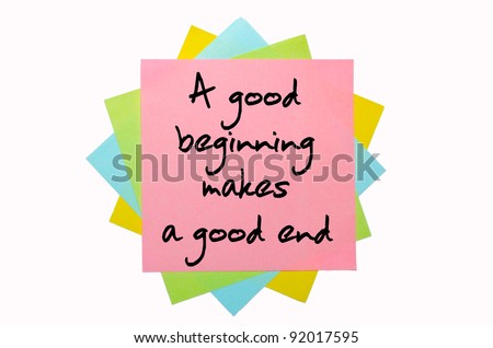 text "A good beginning makes a good end" written by hand font on bunch of colored sticky notes