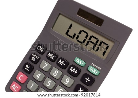 loan written on display of an old calculator on white background in perspective