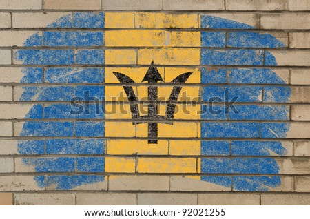 Chalky barbados flag painted with color chalk on grunge old brick wall
