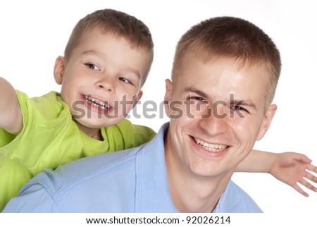 portrait of a dad with his son on a white
