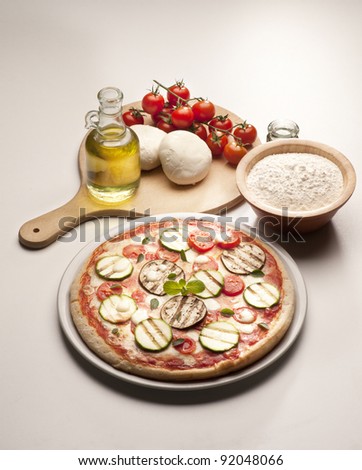 still life with pizza and ingredients