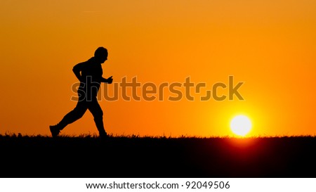 senior jogging in sunrise