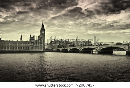 Gloomy and dark image of Houses of Parliament and Westminster bridge