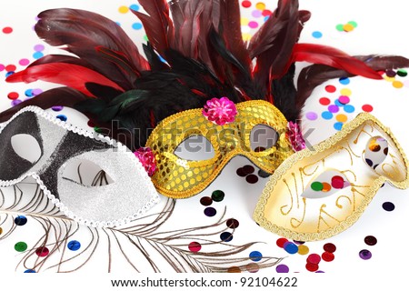 Carnival mask with confetti on white background