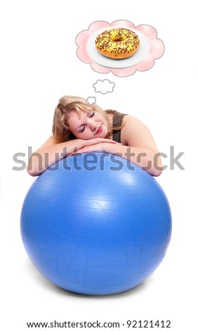 Funny picture of a hungry overweight woman dreaming on ball. Health care concept.