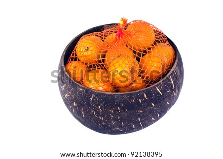 tangerines in coconut shell