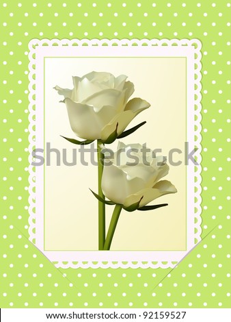 roses on white postcard slotted into a green-polka dot background
