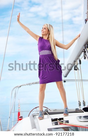picture of joyful young woman having fun on the yacht