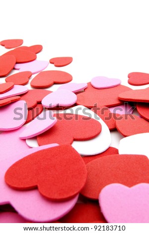 Textured Valentines Day heart-shaped confetti background or border