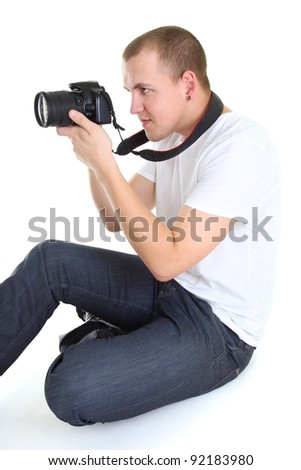 photographer with dslr camera sitting isolated over white background
