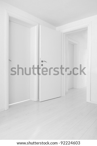 Empty home interior doors and floor