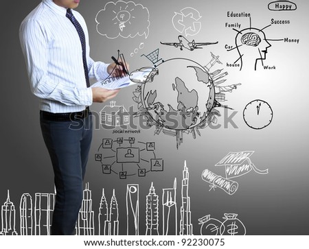 businessman with marker writing something