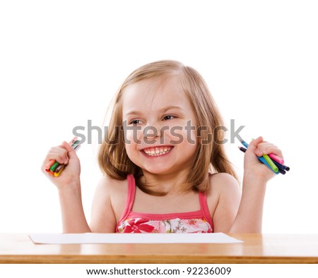 Little Girl drawing picture at table isolated on white