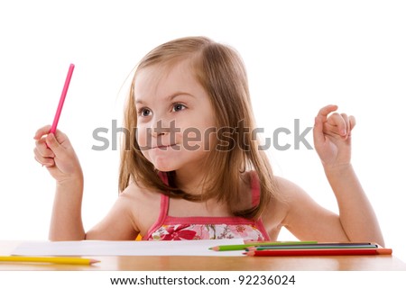 Little Girl drawing picture at table isolated on white