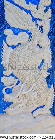 White dragon on a blue wall