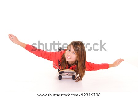 nice teen girl lying on a skateboard