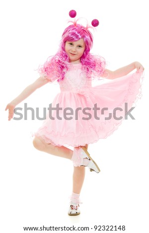 A girl with pink hair in a pink dress dancing on a white background.