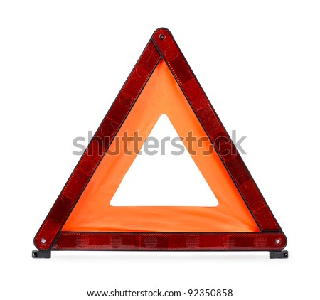 Red reflecting traffic warning triangle isolated on white