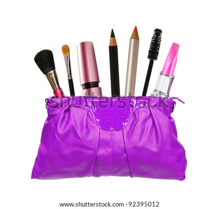 Beautiful violet makeup (cosmetics) bag and cosmetics isolated on white