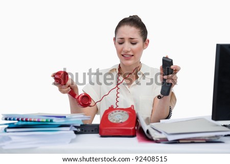 Stressed secretary hanging up against a white background