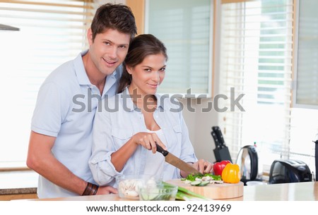 Married couple cooking in their kitchen