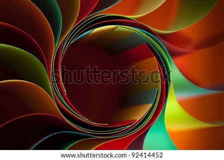 macro image of colorful curved sheets of paper shaped like a flower, on orange background