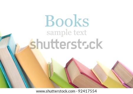 Many colorful books in a row creating a border frame. Isolated on white. Royalty-Free Stock Photo #92417554