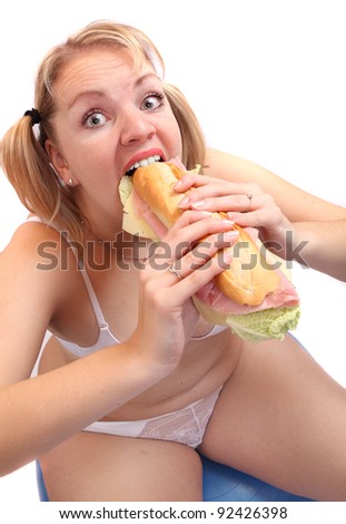 Funny picture of overweight woman eating tasty sandwich.
