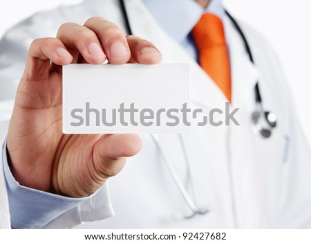 Doctor holding blank business card