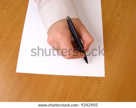 Young businessman writing, closeup