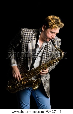 Young musician plays the saxophone.