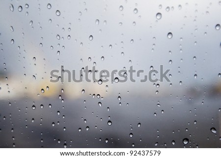 raindrops on glass Royalty-Free Stock Photo #92437579