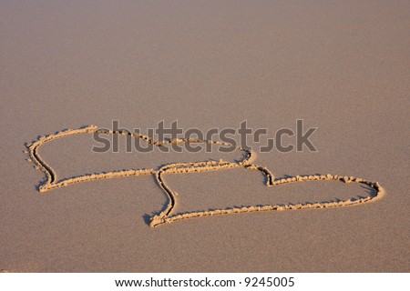 Valentine day background: Two hearts shapes on seashore