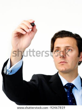 Businessman holds a marker and writes in air, suitable to add your own graph
