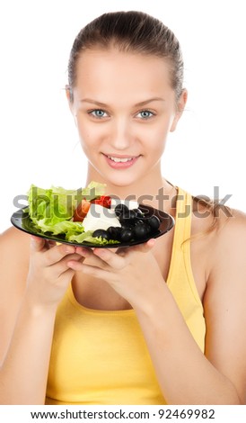 attractive young smiled woman with plate of salad, caucasian shiny girl eating vegetable salad, pretty woman holding the plate of greek salad, healthy vegetarian salad,isolated on white background
