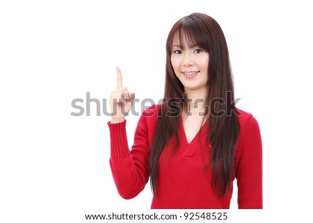 Smiling asian woman rise hand and pointing