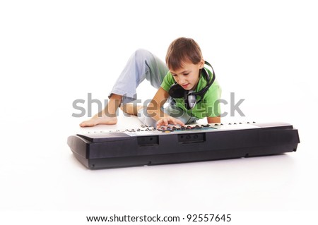 guy sitting on the floor with a synthesizer