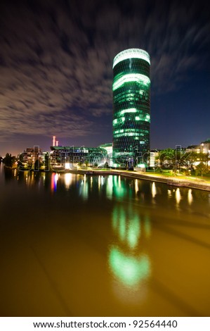 Skyscraper office on the river at night in Frankfurt
