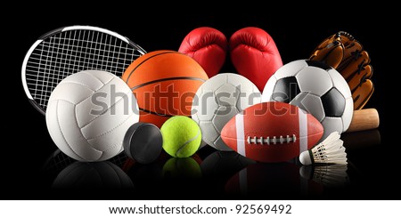 sport equipment and balls in front of black background Royalty-Free Stock Photo #92569492