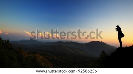 Photographer taking photo on highest mountain view