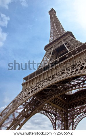 Eiffel Tower. The symbol of Paris and France against the backdrop of clear blue sky. vertical orientation