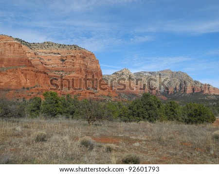   Panoramic views of the mesas and canyons around Sedona, make Arizona a photographer's paradise, a dramatic mix of rough brush and trees and rugged red-rock terrain.