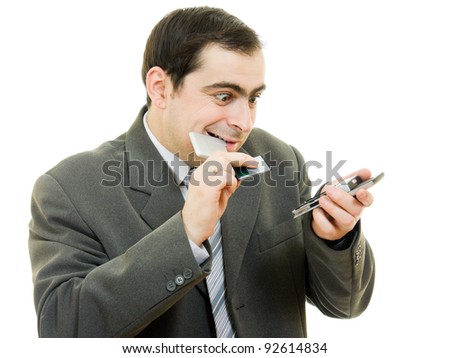 businessman changed the battery in the phone on a white background.