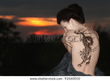 Geisha with dragon tattoo Royalty-Free Stock Photo #92660050