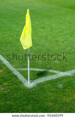 yellow flag in the corner of a football stadium