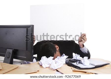 Sleepy businessman holding blank board