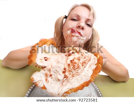 Funny picture of overweight woman eating sweet cream cake.